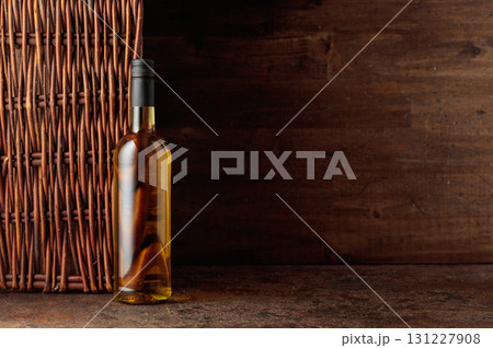 Bottle of white wine on a vintage background. Bottle of white wine on a vintage background. 131227908