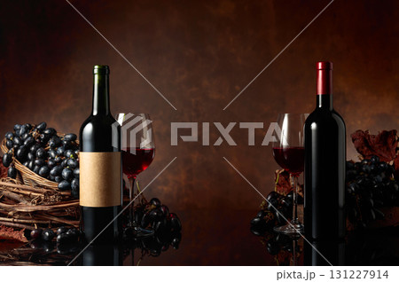 Red wine with blue grapes on a brown background. Red wine with blue grapes on a brown background. 131227914