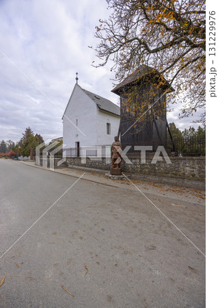 Church of Saint Stephen King in Cecejovce with wooden belfry and statue, Slovakia Church of Saint Stephen King in Cecejovce with wooden belfry and statue, Slovakia 131229976