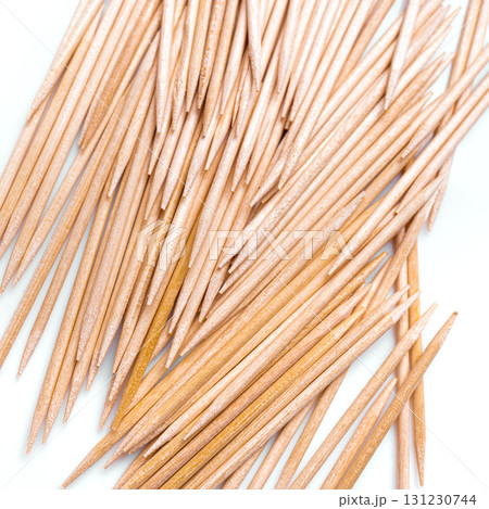 Wooden toothpicks as background closeup 131230744
