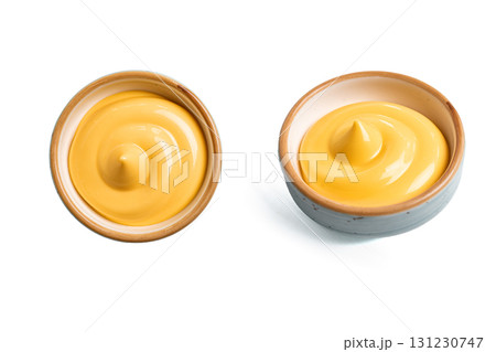 Cheese sauce in bowl isolated on white Cheese sauce in bowl isolated on white 131230747