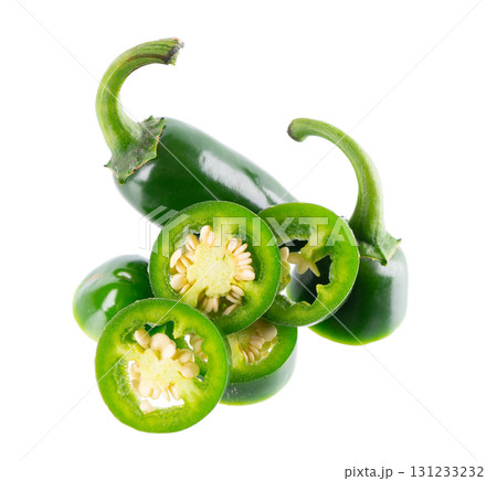 Fresh jalapeno pepper isolated on white background. Slices of green hot serrano pepper. Clipping path. Fresh jalapeno pepper isolated on white background. Slices of green hot serrano pepper. Clipping path. 131233232