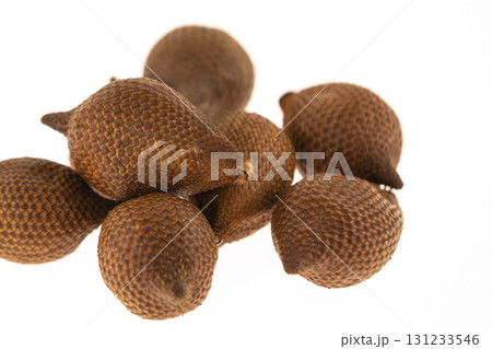 slide brown snake fruit Salaka spread in the markets of Asia on a white isolated background 131233546