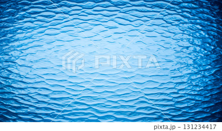Blue water texture background with abstract liquid wave pattern on decorative frosted glass for fresh and clean modern design 131234417