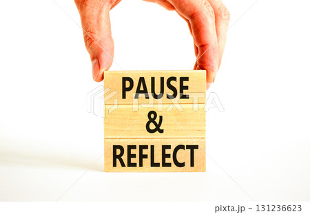 Pause and reflect symbol. Concept words Pause and reflect on beautiful block. Businessman's hand. Beautiful white background. Business motivational lifestyle pause and reflect concept. Copy space. 131236623
