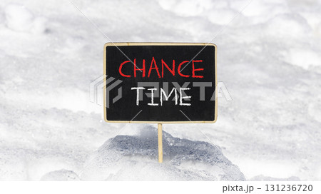 Chance time symbol. Concept word Chance time on beautiful black blackboard. Beautiful white snow background. White snow. Black blackboard. Business chance time concept. Copy space. Chance time symbol. Concept word Chance time on beautiful black blackboard. Beautiful white snow background. White snow. Black blackboard. Business chance time concept. Copy space. 131236720