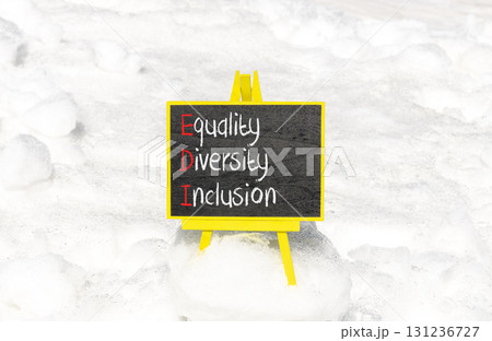EDI equality diversity inclusion symbol. Concept words EDI equality diversity inclusion on yellow blackboard. Beautiful snow background. Business EDI equality diversity inclusion concept. Copy space. 131236727