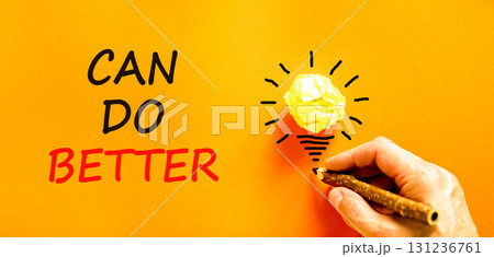 Can do better symbol. Concept words Can do better on beautiful orange paper. Beautiful orange background. Businessman hand with pencil. Business and can do better concept. Copy space. 131236761