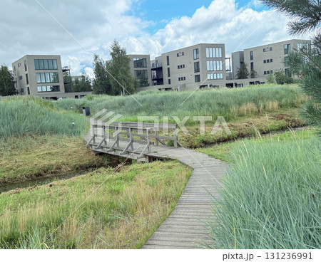 A small bridge over a turbulent stream. A place for families to relax and walk A small bridge over a turbulent stream. A place for families to relax and walk 131236991