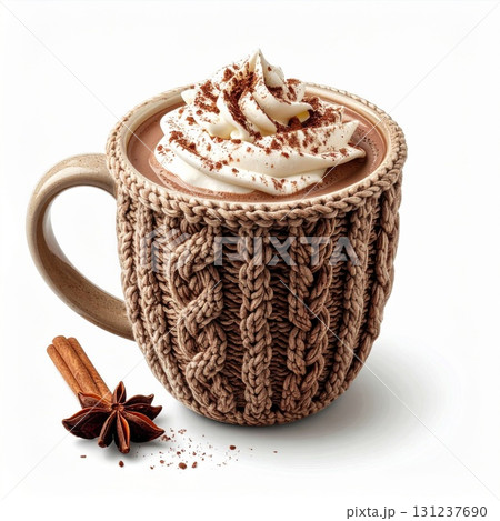Hot Chocolate with Whipped Cream Topped with Cocoa Powder in Knit Mug Beside Cinnamon and Star Anise on White 131237690
