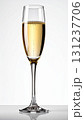 Tall Champagne Flute with Golden Liquid on White Background Celebrating Holiday 131237706