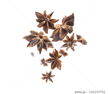 Anise stars levitate on a white background Anise stars levitate on a white background 131237752