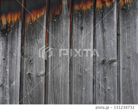 Wooden surface with a lot of grain and a burnt look Wooden surface with a lot of grain and a burnt look 131238732