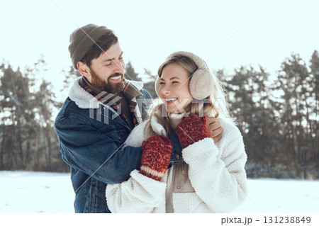 Two people spending a day in a winter forest and looking enjoyed and romantic Two people spending a day in a winter forest and looking enjoyed and romantic 131238849