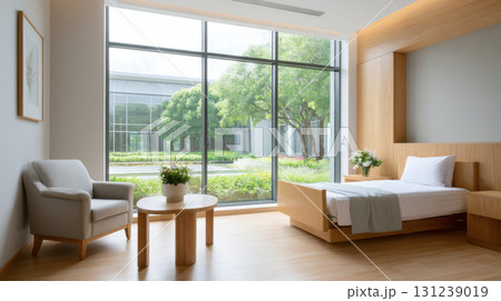 Calm, serene, modern hospital room interior with clean, minimalist furniture. empty recovery space features large window with peaceful view, promoting healing 131239019