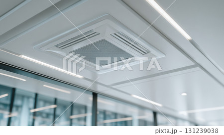 Futuristic white ceiling features modern air conditioner ventilation system. low angle perspective reveals cool and clean office background, evoking calm atmosphere Futuristic white ceiling features modern air conditioner ventilation system. low angle perspective reveals cool and clean office background, evoking calm atmosphere 131239038