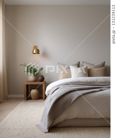 Calm and cozy bedroom interior with modern, minimalist design. comfortable bed with neutral bedding creates tranquil home space for relaxation and sleep 131239113