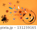 Halloween pumpkin basket with candies and spiders 131239165