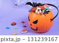 Various halloween sweets on pumpkin basket. Halloween 131239167