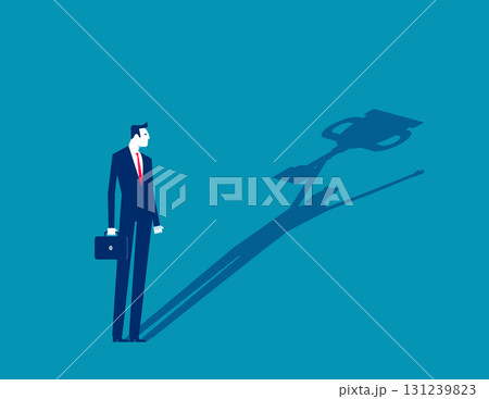 Leader and achievement. Businessman with his shadow holding the trophy 131239823