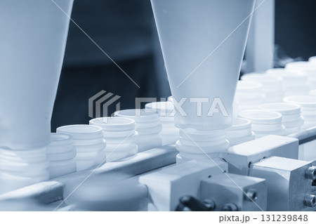 The medicine bottle on the conveyor blet for filling process. The medicine bottle on the conveyor blet for filling process. 131239848