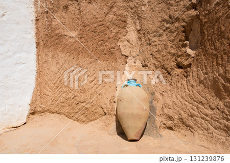 Facade of troglodyte houses with ancient amphora.Tunisia 131239876