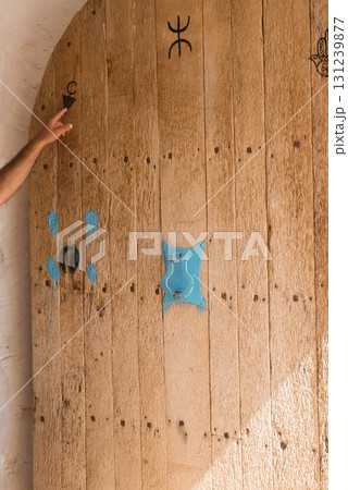 Ancient wooden door. Troglodyte dwelling home. Matmata, Tunisia. Ancient wooden door. Troglodyte dwelling home. Matmata, Tunisia. 131239877