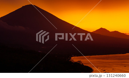 Drone view with Agung volcano and sunset with ocean in Bali. 131240660