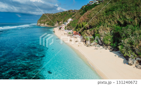 Tropical sandy beach with quiet ocean in Bali. Aerial view of popular location Melasti beach 131240672