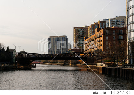Chicago riverfront with bridges and tall buildings under a beautiful, slightly cloudy sky. 131242100