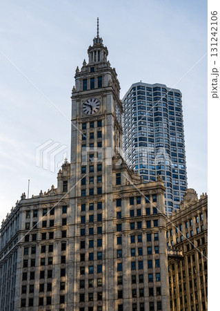Iconic Chicago architecture featuring a historic clock tower and modern high-rise. Iconic Chicago architecture featuring a historic clock tower and modern high-rise. 131242106