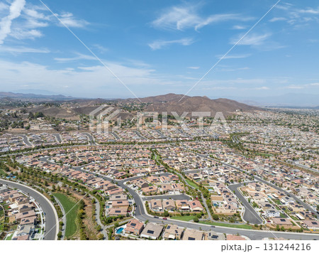 Aerial view of a sprawling neighborhood of family homes in Menifee, California, USA. 131244216