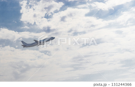 Shot of the airplane in the cloudy sky that just took off 131244366