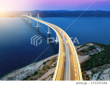 Aerial view of modern Peljesac bridge and blue sea at sunset 131245168