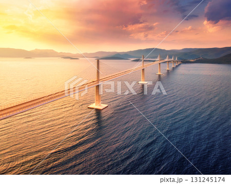 Aerial view of modern Peljesac Bridge and blue sea at sunset 131245174