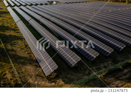 Rows of solar panels in countryside fields on 131247873