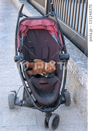 Teddy Bear toy inside empty stroller Teddy Bear toy inside empty stroller 131248370