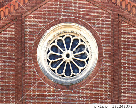 Circle window on brick wall 131248378