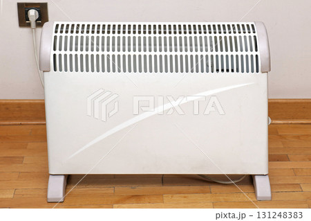 Heater on wooden floor 131248383