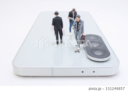 Business Figures Stand On A Large Smartphone Surface 131249857