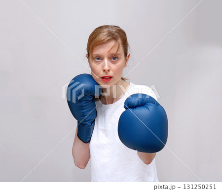 Female boxer in fight Female boxer in fight 131250251