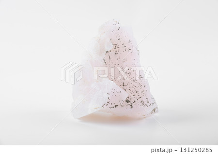 Pink calcite mineral stone, also known as manganoan calcite, a calcium carbonate crystal specimen with soft pale pink color and natural texture. 131250285