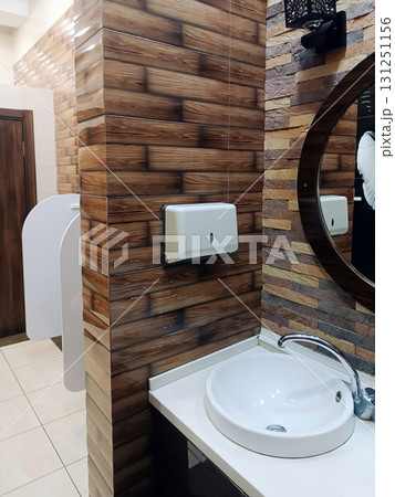 bathroom and toilet interior with a white ceramic sink 131251156