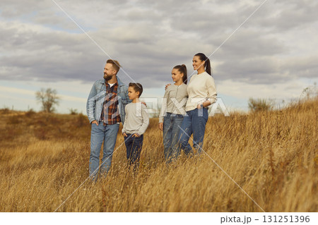 Portrait of happy smiling family with son and daughter walking standing enjoying beautiful nature Portrait of happy smiling family with son and daughter walking standing enjoying beautiful nature 131251396