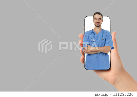 Doctor using smartphone tech to showcase medical skills Doctor using smartphone tech to showcase medical skills 131253220