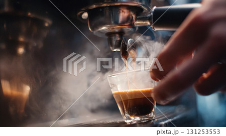 First-person view of espresso shot brewing with crema and steam rising First-person view of espresso shot brewing with crema and steam rising 131253553