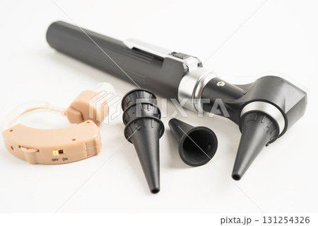 Otoscope isolated on white background for otolaryngologist or ENT physician doctor examining senior patient ear, hearing loss problem. 131254326