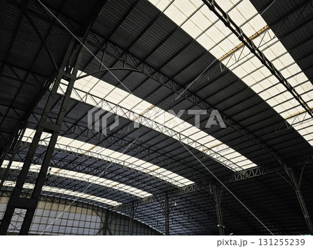 Modern Industrial Roof Structure with Translucent Panels and Steel Trusses. 131255239