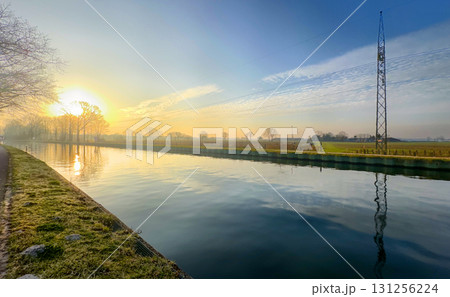 Breathtakingly beautiful serene sunrise over a tranquil canal landscape that inspires peace, Breathtakingly beautiful serene sunrise over a tranquil canal landscape that inspires peace, 131256224