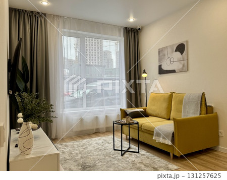 modern living room in a stylish interior of a new apartment with designer renovation modern living room in a stylish interior of a new apartment with designer renovation 131257625